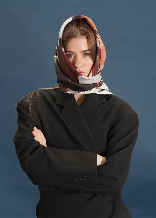 woman wrapped with head scarf- earth tones- browns, chocolate, checkered border.