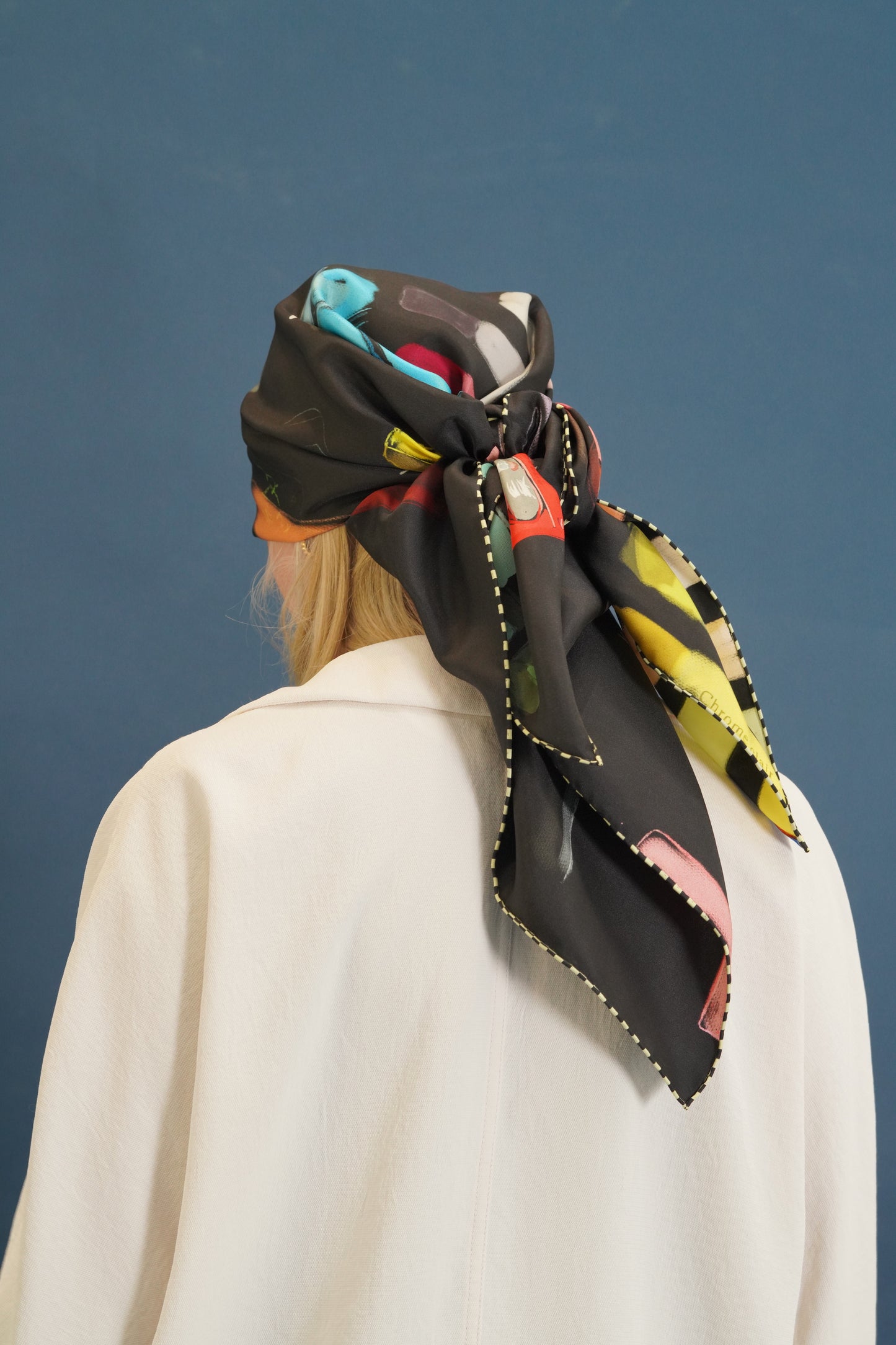 black head silk scarf tied on a woman