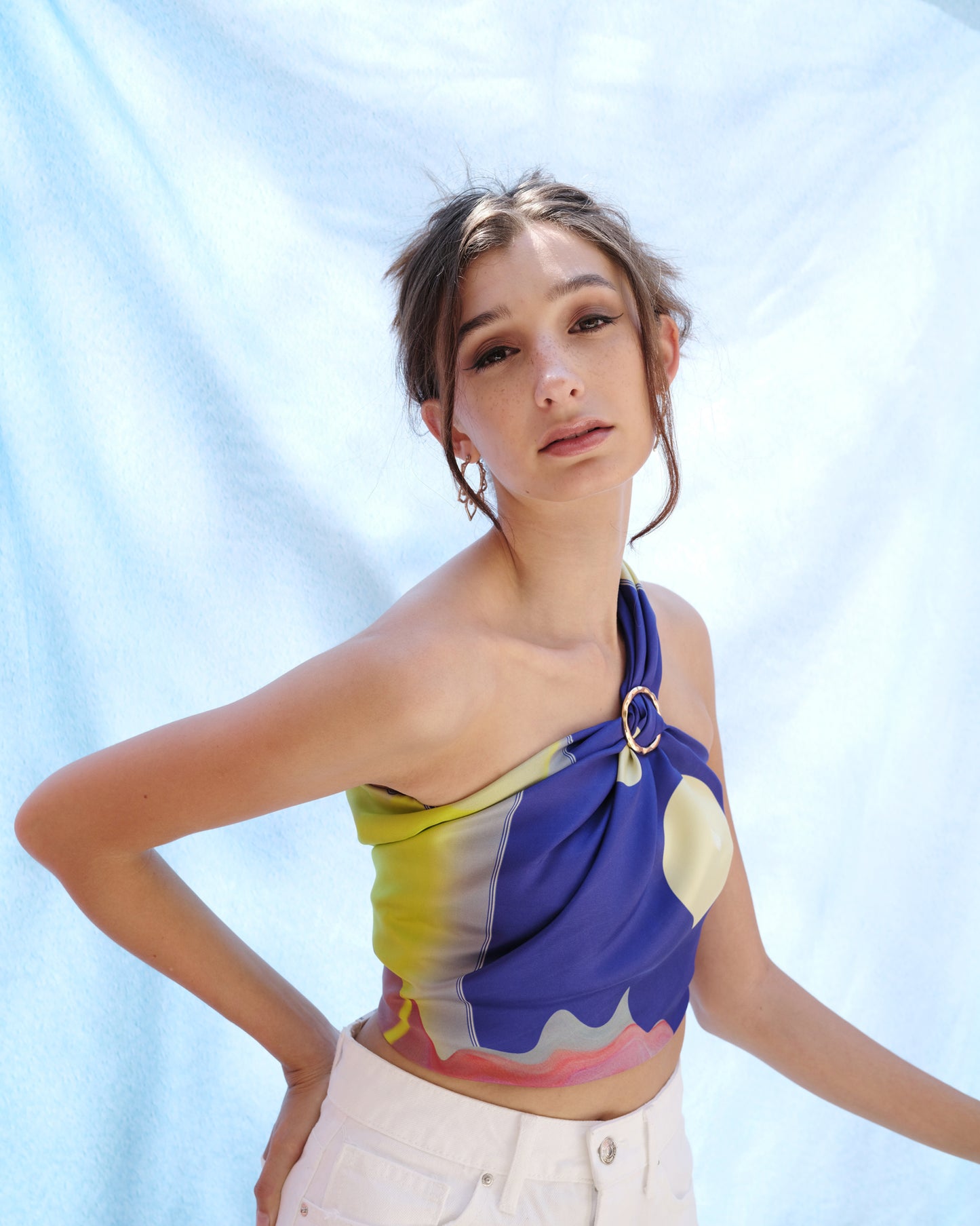 Blue 100% silk twill scarf with woman wearing a blue scarf top.