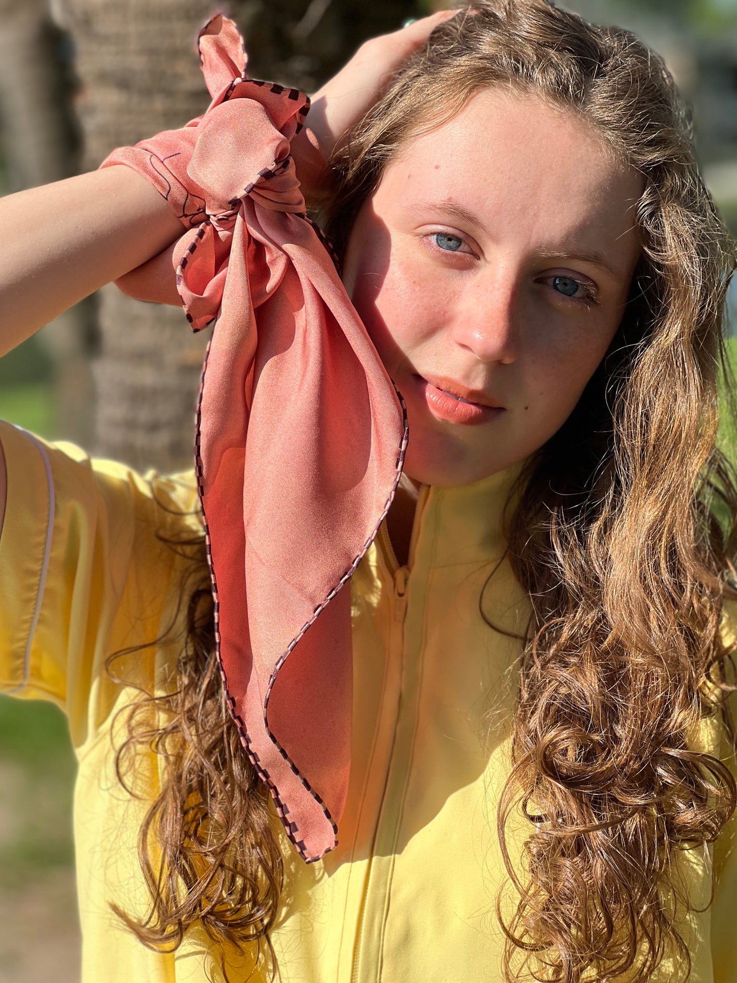 girl wearing scarf on wrist