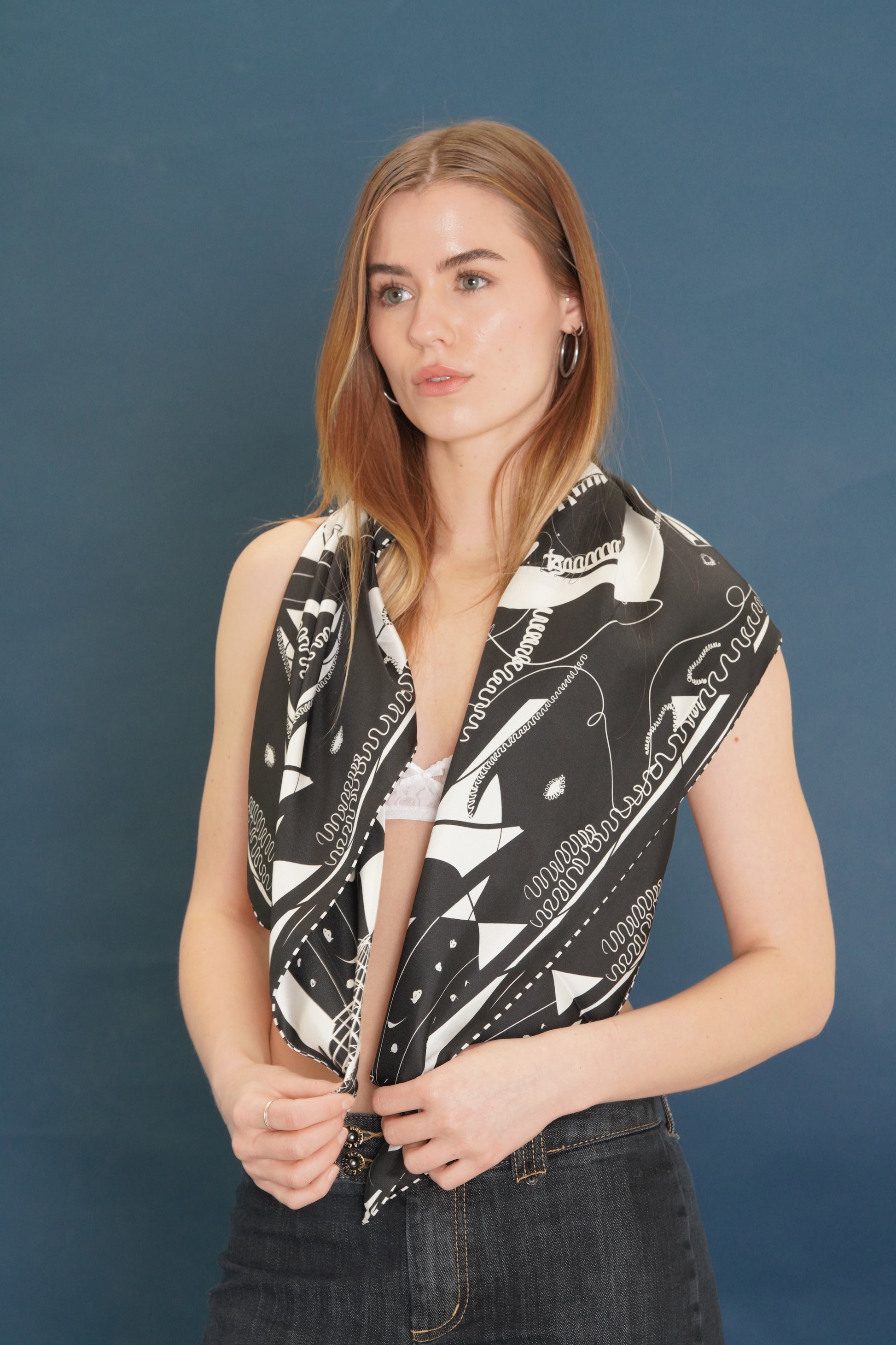 woman with silk scarf over shoulders- black and white modern design. 