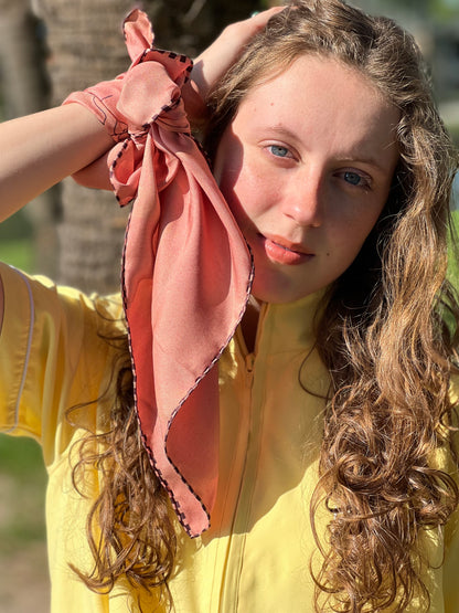 girl wearing scarf on wrist 